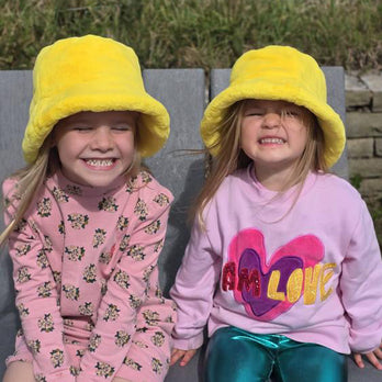 Child wearing Little Hotdog Watson Fur Bucket Hat in Yellow